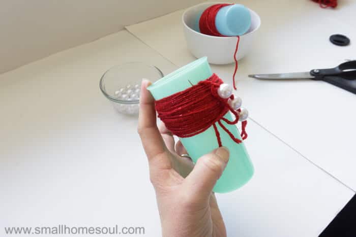 Tying the threads on Christmas Tassel Ornament.
